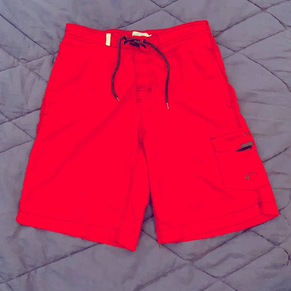 Teal Cove, red swimming shorts